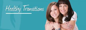 A woman and a girl are smiling and embracing in front of a teal background. The text "Healthy Transitions" is written in white cursive script on the left side of the image.