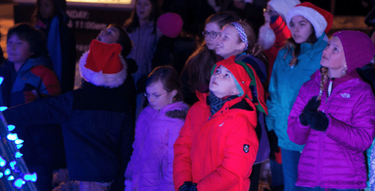 Children Looking up at Christmas Tree