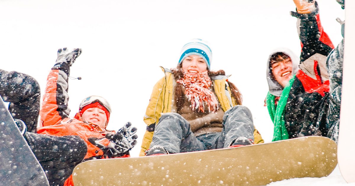 girls and boys snowboarding