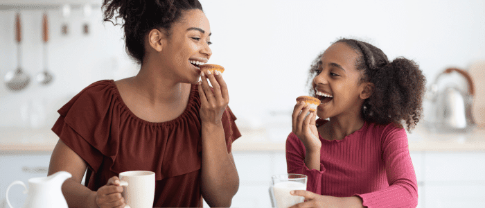 mom and daughter eating food together