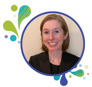 A woman with short light brown hair smiles at the camera. She is wearing a black blazer and is framed by a blue circle with colorful, abstract shapes around it.