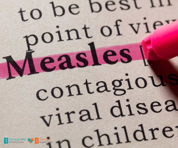 A pink highlighter underlines the word "Measles" in a dictionary entry, with related text about contagious diseases visible nearby.